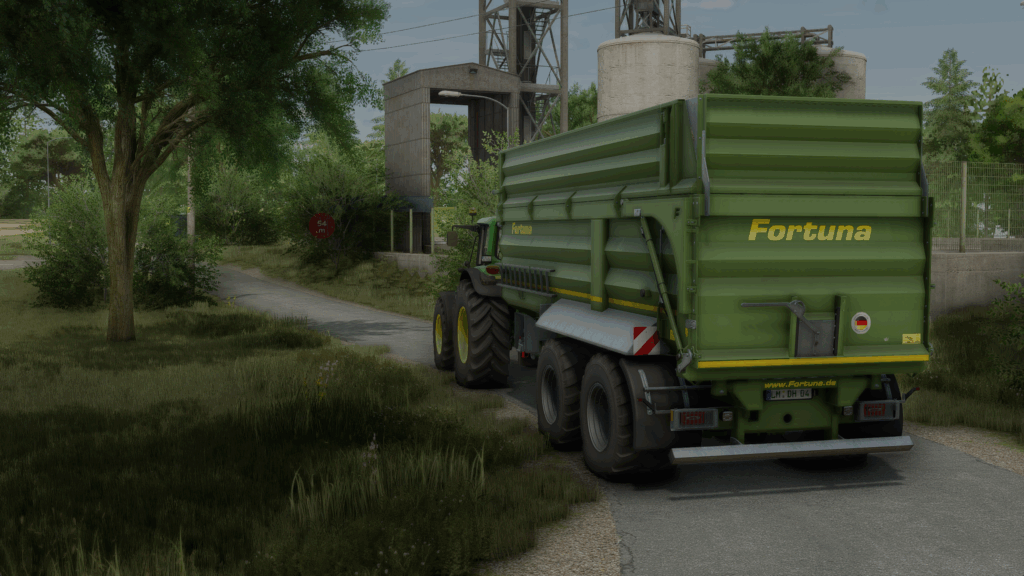 DH_Agrar John Deere mit Fortuna Kipper auf dem Weg zum Drescher im Feld